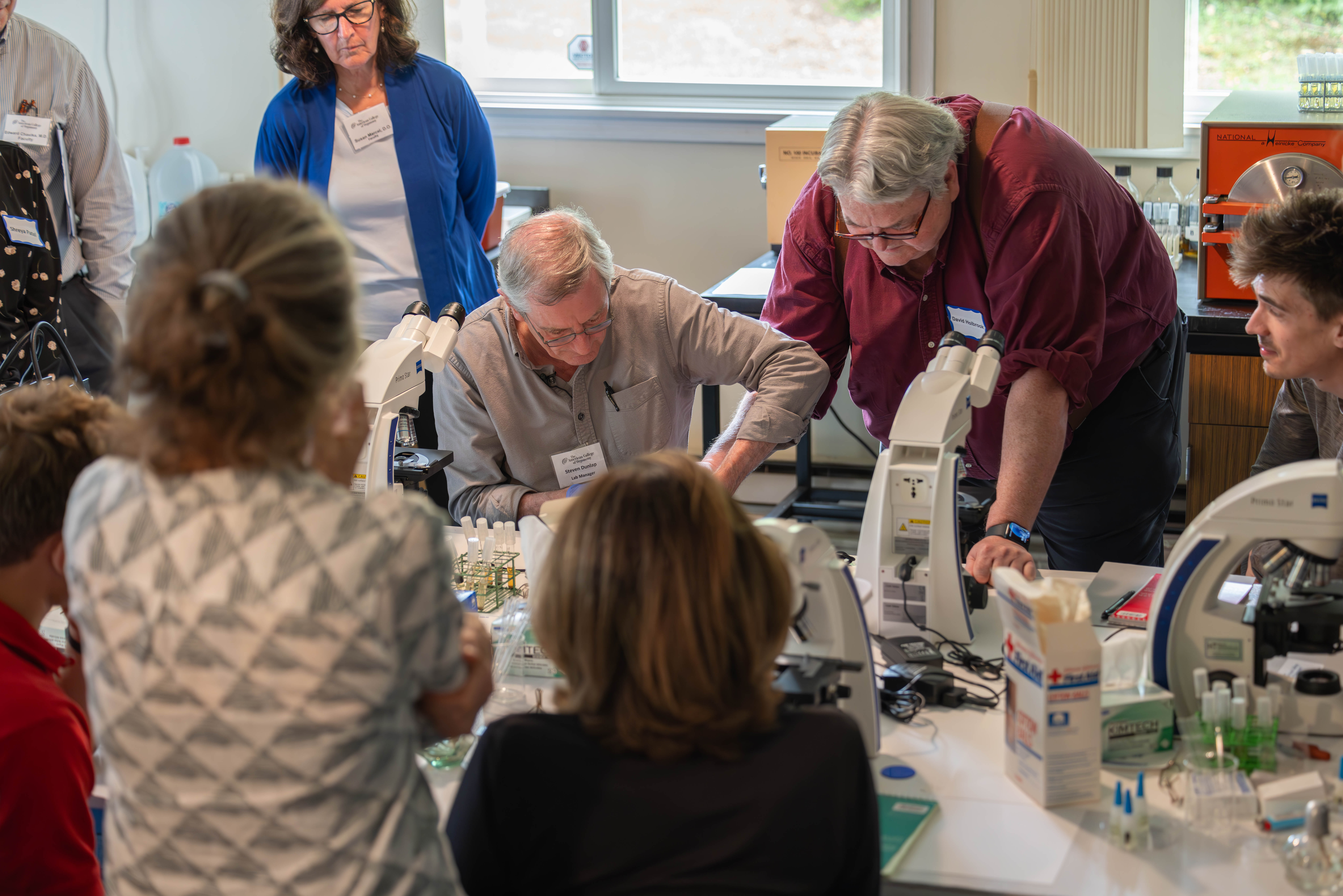 Students and Faculty working in lab.